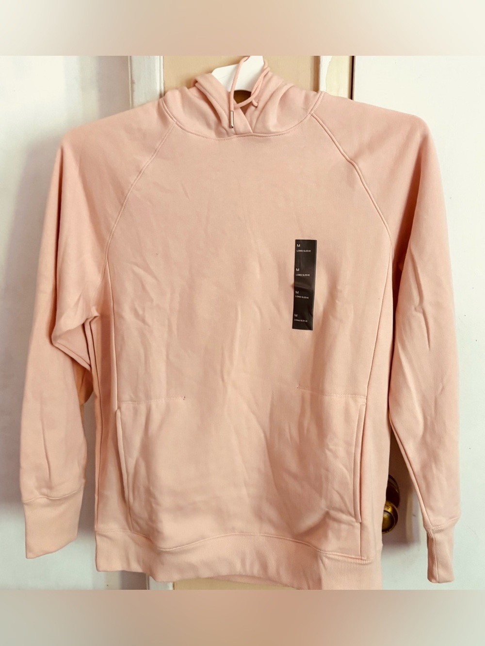 New!  Peach/pink hoodie sz MED.
